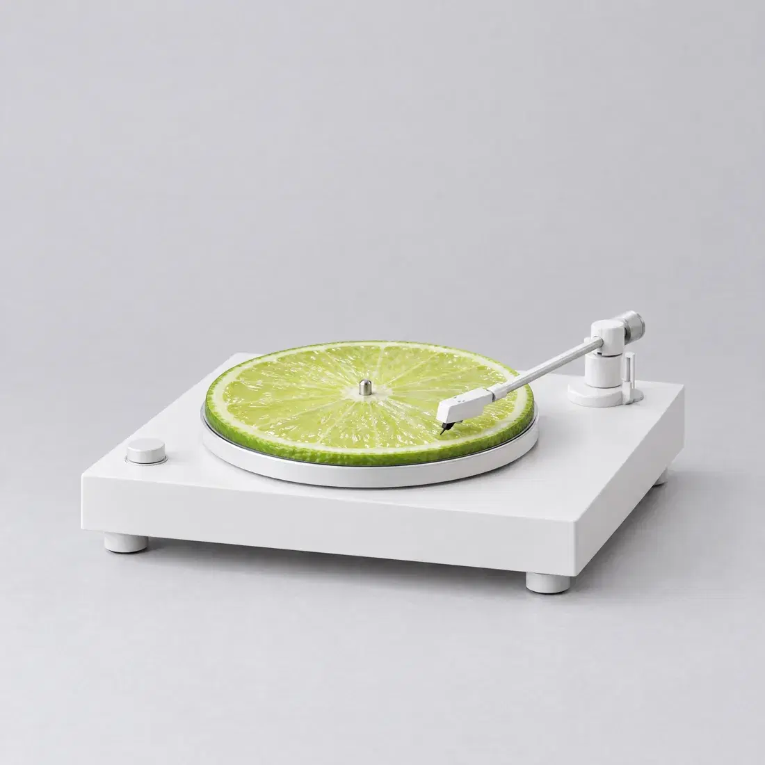 a lime slice spinning on a white turntable